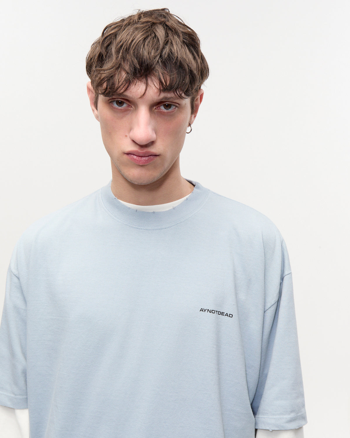 REMERA OVER GASTADA