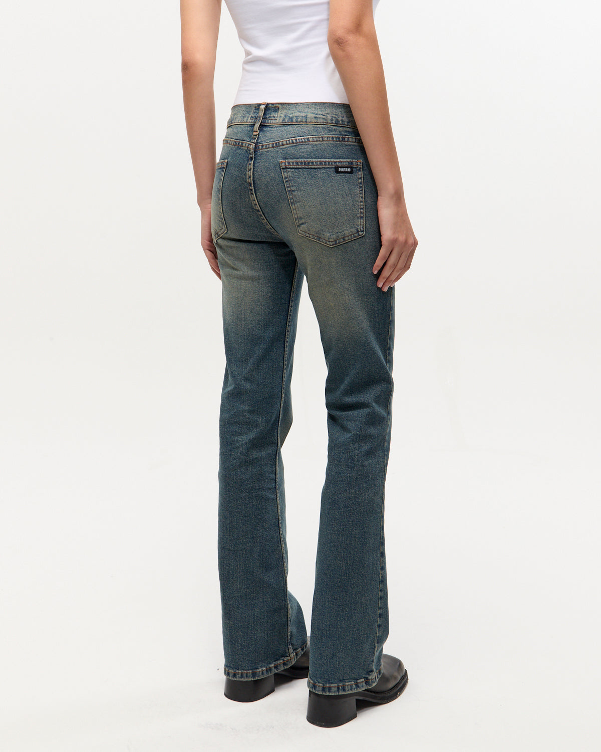 BOOTCUT LOW RISE OILED BLUE